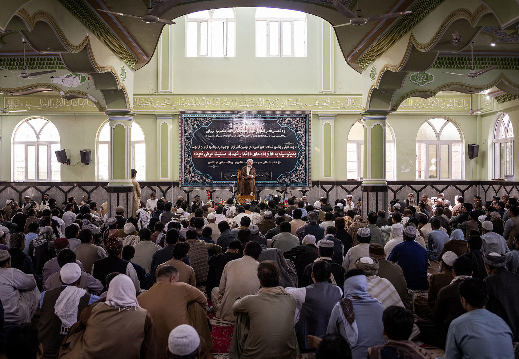 People fill the Bibi Fatima Mosque in Kandahar, Afghanistan, on October 18, 2021, after a deadly attack claimed by Islamic State Khorasan Province. (Photo by Jim Huylebroek/New York Times)